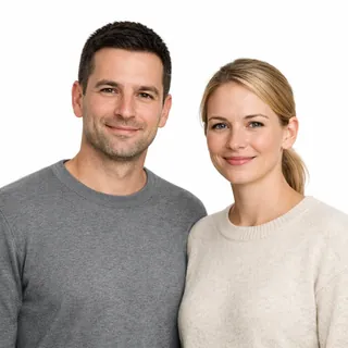 A man and a woman side by side on a white background, both faces fully visible