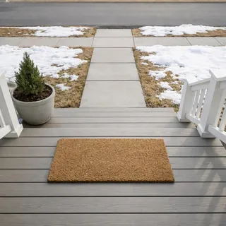 Empty porch with a doormat, seen from just above the front door
