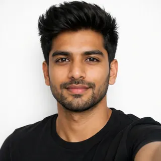 Front-facing head-and-shoulders selfie of a man on a white background