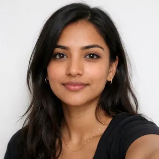 Front-facing selfie of a woman on a white background