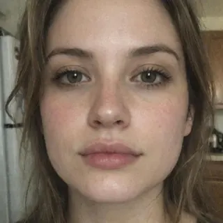A close-up selfie cropped at the chin with no shoulders visible