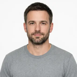 Front-facing chest-up portrait of a man on a white background