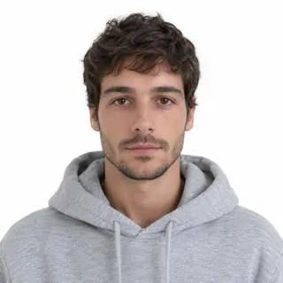 A person in a plain grey hoodie on a white background