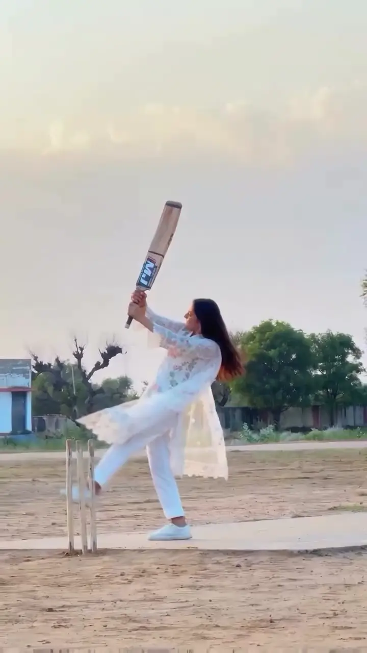 The bat is up above the shoulder at the fastest point of the swing