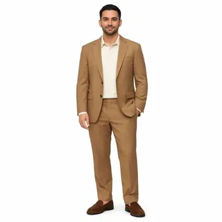 Full-length photo of a man in a camel suit and brown loafers on a white background