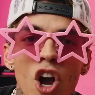 A man wearing pink star-shaped sunglasses that hide his eyes