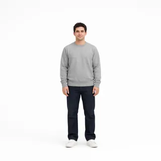 Full-length photo of a man in a gray sweatshirt, jeans and white sneakers on a plain white background