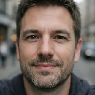 A close selfie of a man's face, cut off at the forehead