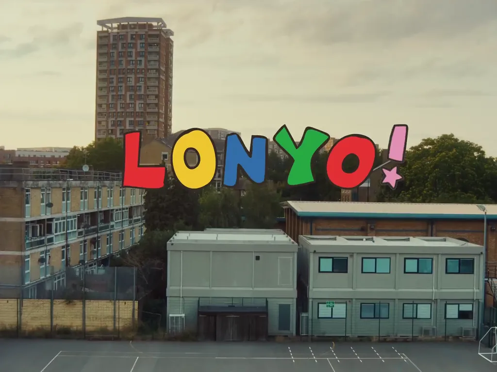 The word LONYO! in big multicoloured letters over a London school and a tower block, from the video's title card