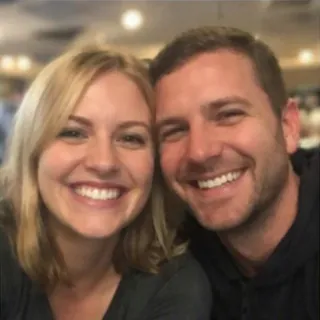 Two friends squeezed into one selfie in a café