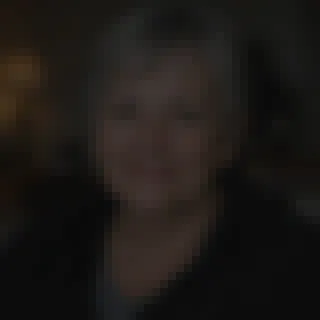 A dark, pixelated portrait that is hard to recognize