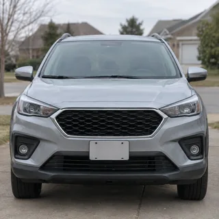Silver SUV photographed head-on in a driveway