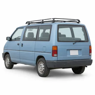 Older pale-blue minivan with a roof rack, rear three-quarter angle, on white