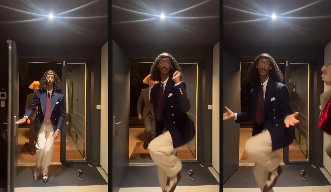 Three trend clip stills: the dancer in a navy blazer and long curly wig steps through the door, kicks a knee up and opens his arms