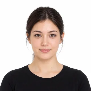 Front-facing portrait of a woman with her hair pulled back on a white background