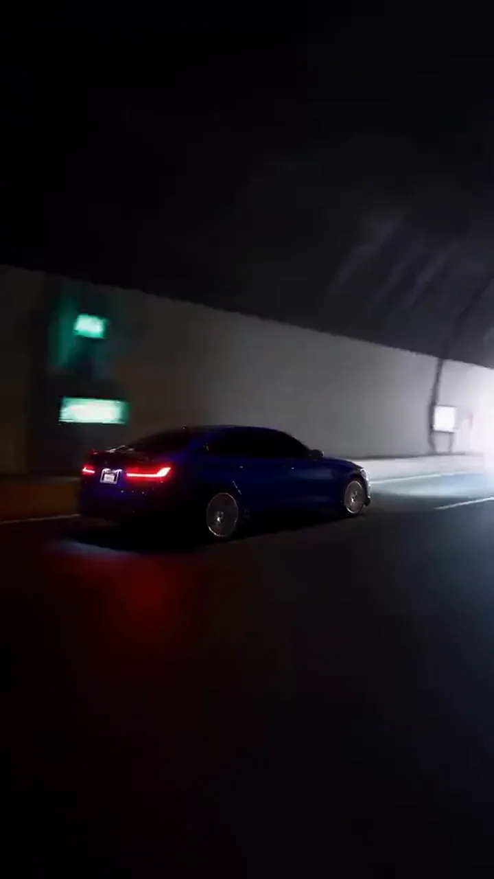 The window edge sliding away as the car grows to full size in the same shot