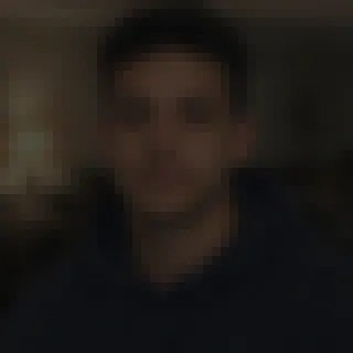 A dark, pixelated photo where the face can't be made out